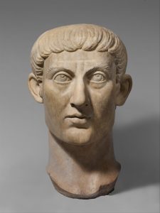 Marble portrait head of Emperor Constantine I, with large upward-looking eyes and short carved hair.