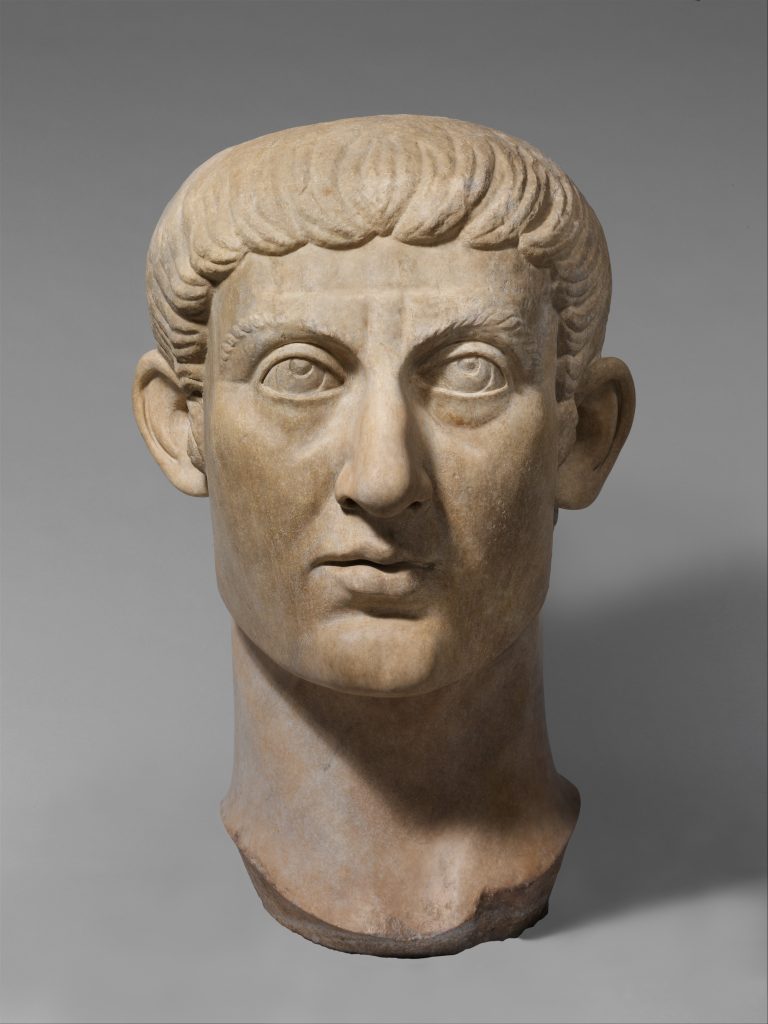 Marble portrait head of Emperor Constantine I, with large upward-looking eyes and short carved hair.
